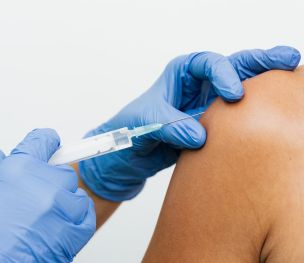 Injection on the Arm of a Person